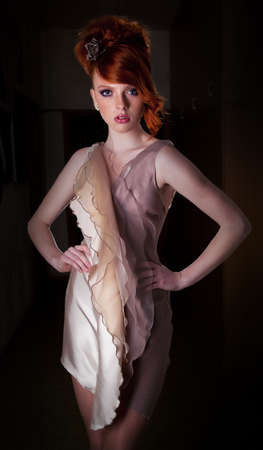 Red haired super model posing in fashion dress - series photos の写真素材