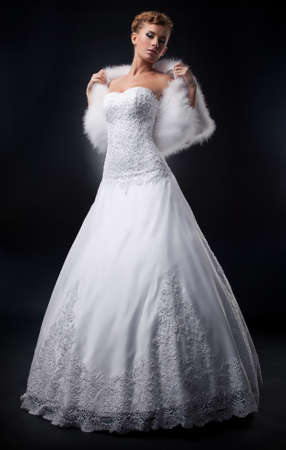 Spectacular pretty bride blonde in nuptial white dress の写真素材