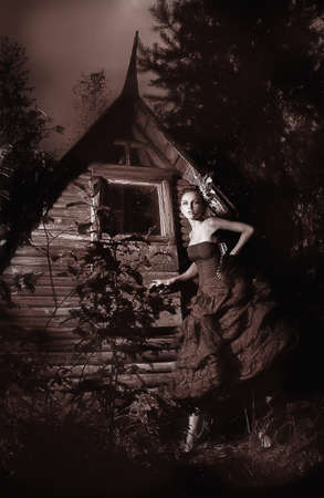 Night scenic - beautiful fairy walking along wooden hut black and white photo の写真素材