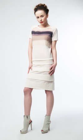 Beautiful fashionable woman brunette posing in studio - fashion styleの写真素材