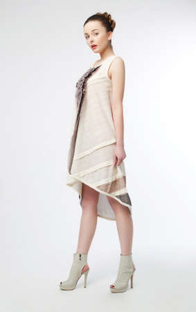 Full portrait of young beautiful fashionable woman with modern coiffure - series of photosの写真素材
