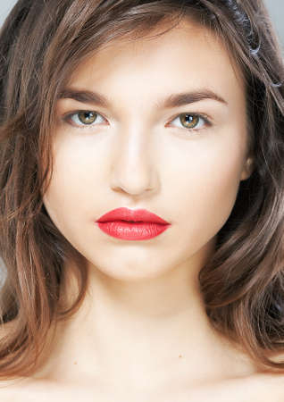 Portrait of beautiful sexy girl with sensual red lips closeup  Studio shotの写真素材