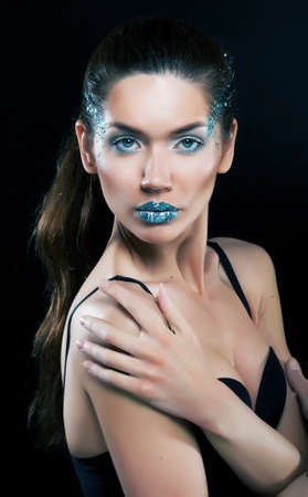 Fashion concept  Beauty woman face with bright blue makeupの写真素材
