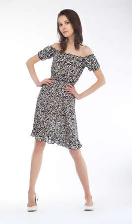 Elegant fashionable woman with long brown hair posingの写真素材