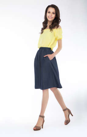 Beautiful fashion woman posing in modern clothing, studio shot の写真素材