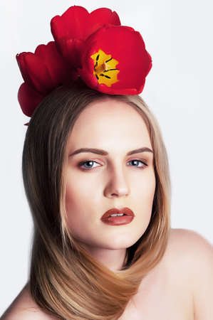 Holidays  Pretty woman with red tulips close up portrait  Valentine s dayの写真素材