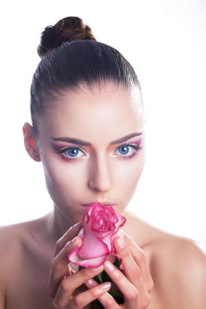 Sensual stylish young woman with pink flower - beautiful roseの写真素材