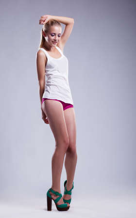 Fashion beautiful erotic woman with sexy body and blond hair - series of photosの写真素材