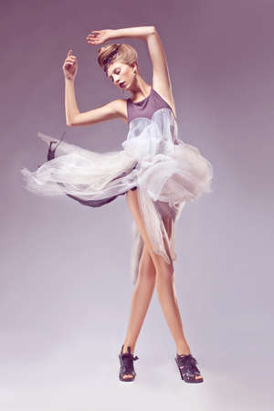 Fashion female in medieval vintage era dress. Dance, carnivalの写真素材