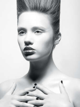 Portrait of beautiful young woman with creative hairdoの写真素材