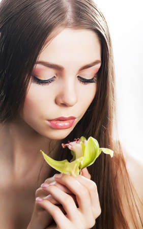 Sensual beaty woman with flower, fresh orchidの写真素材