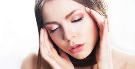 Dreamy sensual beauty - fresh young woman face, natural make-up. Headacheの写真素材