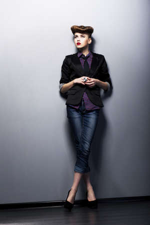 Pin up girl in american retro style - old-fashioned tie, shirt and jacketの写真素材