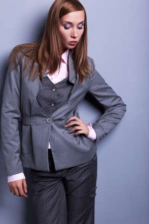 Graceful Stylish Woman in Grey Costume - Vogue Styleの写真素材