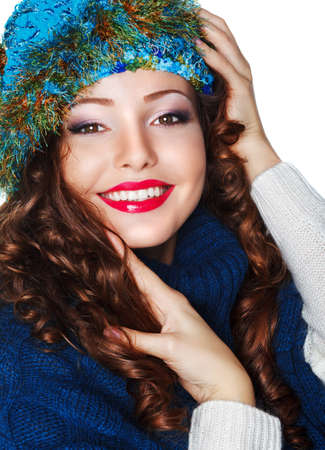 Happy Smiling Brunette wearing Knitted Blue Cap and Jerseyの写真素材