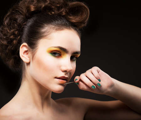 Ambition. Glamor. Sophisticated Lady Fashion Model with Needleの写真素材