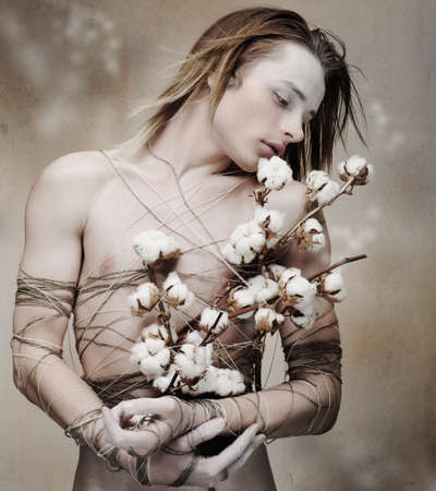 Stylized Young Loving Man with Bunch of Blooming Flowers. Blursの写真素材