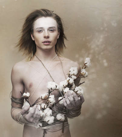 Fondness. Romantic Young Man giving Present - Flowers. Affectionの写真素材