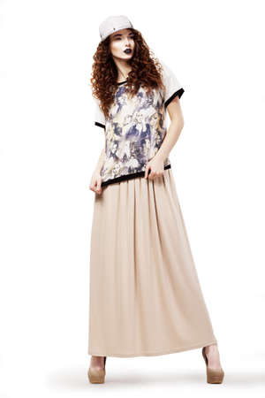 Modish Glamorous Woman in Fashion dress and Cap posing  Studio shotの写真素材