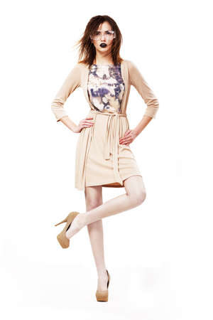 Glamor. Stylish Classy Woman in Modern Glasses standing on one legの写真素材