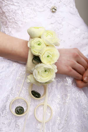Arrangement. Bouquet of Flowers as a Bracelet on Woman's Hands. Floristicsの写真素材