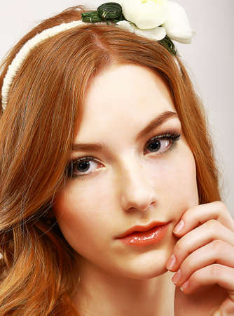 Goodness. Portrait of Young Meek Woman with White Flower on her Headの写真素材
