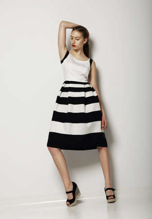Individualism. Confident Young Woman in Contrast Light Sundressの写真素材