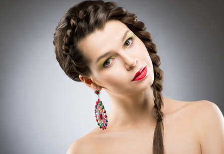 Portrait of Bright Brunette with Jewellery - Round Colorful Earring. Shining Bijouterieの写真素材