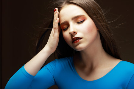 Distress  Woe  Upset Tired Woman Touching her Forehead  Difficulties