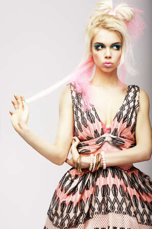 Stylish Woman in Modern Bright Dress and Stylized Makeup. Temperの写真素材