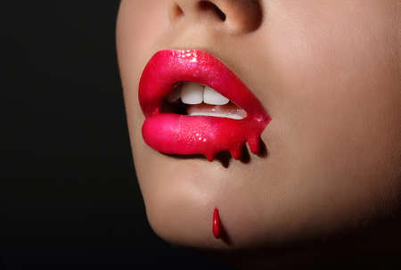 Splash. Woman's Red Lips with Dripping Lipstick. Creativityの写真素材