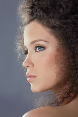 Profile of Young Brunette Fashion Model with Frizzy Hairの写真素材