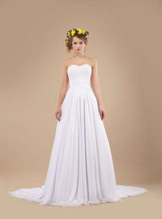 Espousal. Bride Fashion Model with Wreath of Flowers in White Dressの写真素材