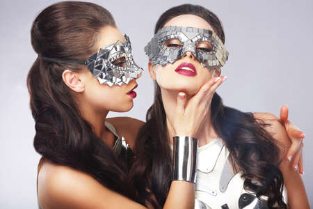 Performance. Entertainment. Women in Silver Shiny Masks. Artistryの写真素材