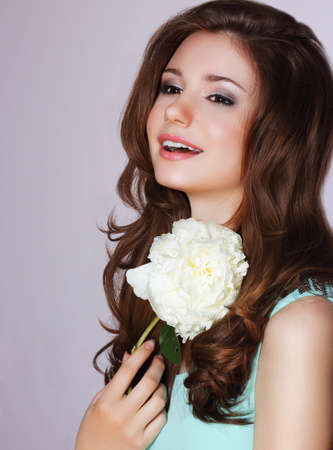 Freshness. Happy Woman with Peony Flower Smilingの写真素材