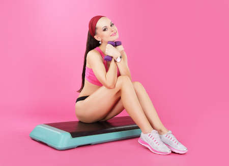 Recreation. Slender Calm Woman with Dumbbells Relaxingの写真素材