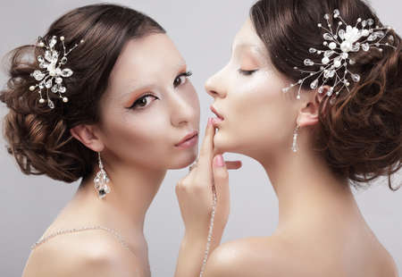 Sensuality. Two Women Fashion Models with Trendy Make-upの写真素材
