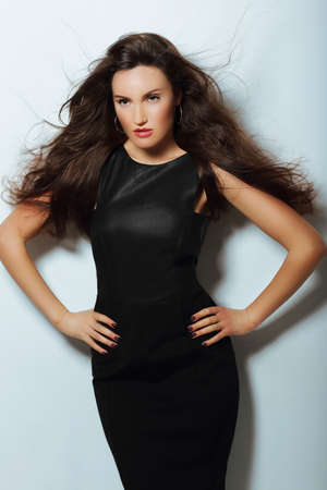 Gorgeous Lady in Black Evening Dress with Loosing Long Hairsの写真素材