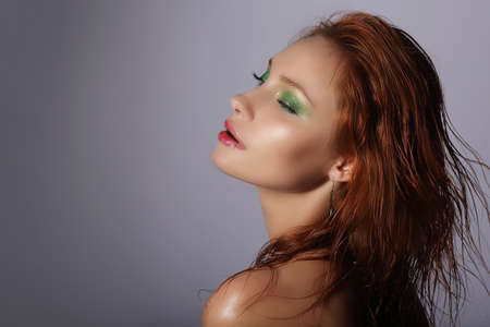 Imagination. Redhead Woman with Wet Hair Dreamingの写真素材