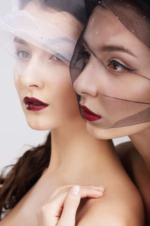 Fondness. Two Females in Veils Embracingの写真素材