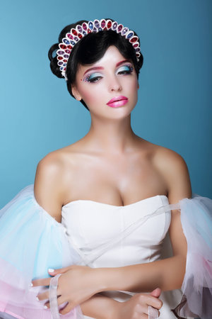 Inspiration. Fashion Model with Dramatic Theatrical Makeup and Diademの写真素材