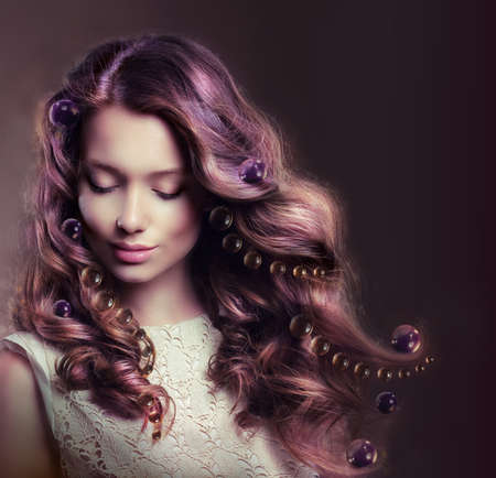 Beauty Portrait of Young Woman with Flowing Hairsの写真素材
