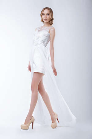 Slender Fashion Model Wearing White Dressの写真素材