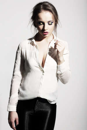 Thinking Seductive Woman in White Blouseの写真素材