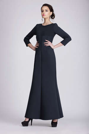 Studio Shot of Young Woman in Dark Dressの写真素材