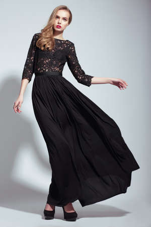 Elegance. Young Fashion Model in Black Dressの写真素材