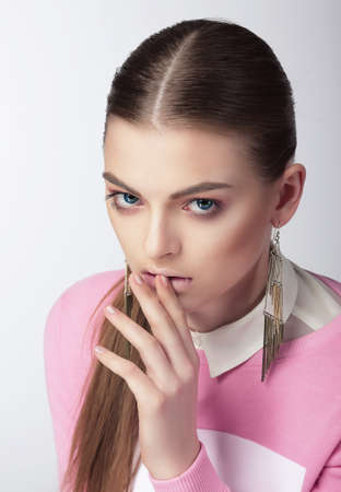 Portrait of Young Woman with Earringsの写真素材