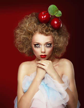 Doll woman with cherries. Artist makeup.の写真素材