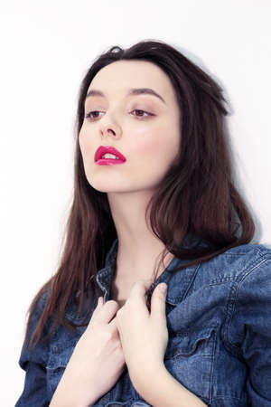 Model lady with natural make-up and red lips. Portrait of a female model.の写真素材