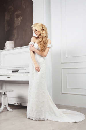The bride in a white dress in full growth.の写真素材